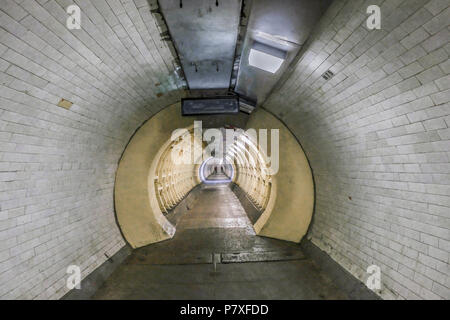 Old tunnel built in 1902 to cross from north to south of the River Thames and still in fulll operation, having just had some restoration. Stock Photo