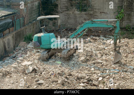 View of excavator machine working in construction site. Movement. Stock Photo