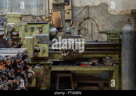 Old and dirty lathe machine. Stock Photo