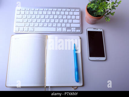 Workplace business still life. blank empty notebook, laptop tablet pc mobile phone, pen Stock Photo