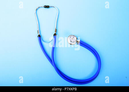 Medical blue stethoscope isolated on blue background Stock Photo