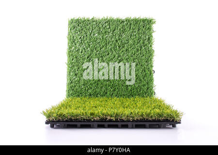 Grass mat on white background. Artificial turf tile background. Object and background concept. Stock Photo