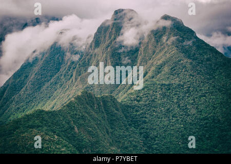 Andes mountains with clouds above the peak. Inca Trail. Peru Stock Photo