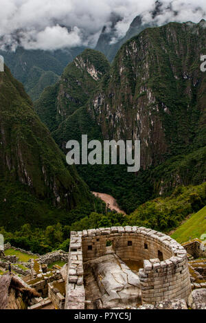 Machu Picchu hill top house with stone wall foreground Stock Photo - Alamy