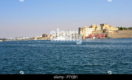 Brindisi, Italy - April 30, 2018: Federciano  Castle, military port and ship in Brindisi at sunset Stock Photo
