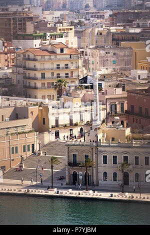 Brindisi, Italy - April 30, 2018: Terminal columns of the ancient Via Appia that begins in Rome and ends in Brindisi (Italy) and tourists visiting Stock Photo