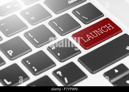 'LAUNCH' Red button keyboard on laptop computer for Business and Technology concept Stock Photo