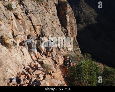 Backpackers negotiating a steep trail to visit the Cave of Domes on Horseshoe Mesa, grand Canyon National park, Arizona, United States. Stock Photo