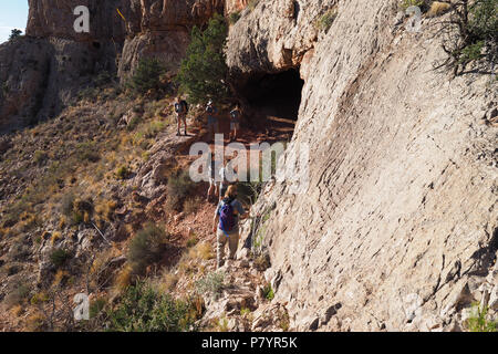 Backpackers negotiating a steep trail to visit the Cave of Domes on Horseshoe Mesa, grand Canyon National park, Arizona, United States. Stock Photo