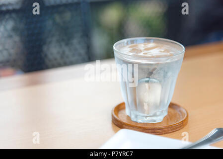 Mineral water in glass on wood table with abstract background, selective focus on stream, Food drinks and Healthcare concept Stock Photo
