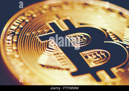 Golden Bitcoin. Closed up bit coin. Cryptography and Electronic money concept. Currency trading and Gold mining theme. Business and Technology theme. Stock Photo