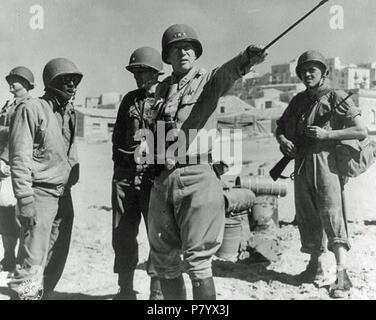 English: General George S. Patton in command of US forces on Sicily . 1943 250 Lt.-General-George-Patton-instructing-troops-in-Sicily Stock Photo