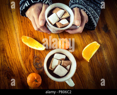 Sharing a cup of hot chocolate with marshmallows Stock Photo