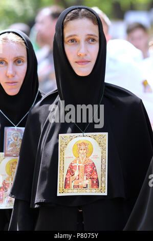Nuns in black cassocks and icons on chests. Procession devoted to the Day of Baptism of Rus. July 27, 2017. Kiev, Ukraine Stock Photo