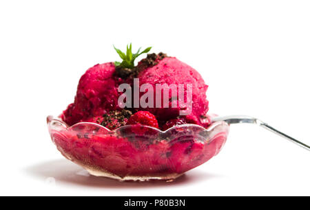 Raspberry ice cream scoops in a bowl on white Stock Photo