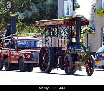 A Aveling traction engine simmers outside the Spinner and Bergamot pub in Comberbach near Northwich in Cheshire. The engine was taking part in a steam Stock Photo