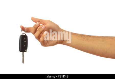 Male hand holding a car key isolated on white background, clipping path Stock Photo