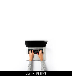 Woman working on laptop over white background Stock Photo