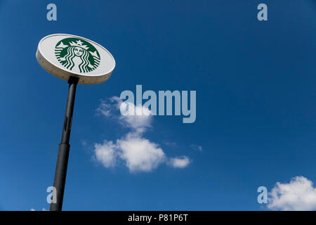 A logo sign outside of a Starbucks coffee shop in Beloit, Wisconsin, on June 23, 2018. Stock Photo