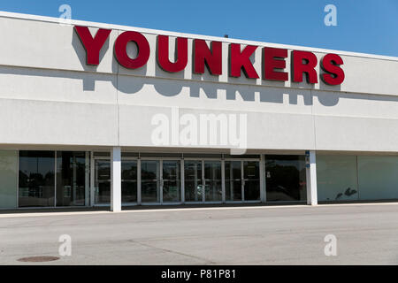 A logo sign outside of a Younkers retail department store in Omaha ...