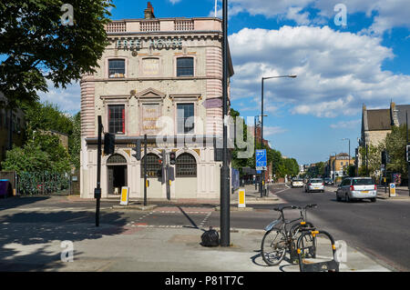 The historic George Tavern pub on Commercial Road, Stepney, East London UK, with Jubilee Street in foreground Stock Photo