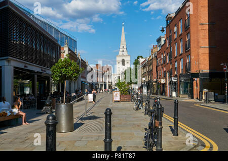 The redeveloped Spitalfields district in East London, UK, looking down Brushfield Street towards the Christ Church, with Old Spitalfields Market Stock Photo