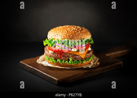 Homemade hamburger or burger with fresh vegetables and cheese Stock Photo