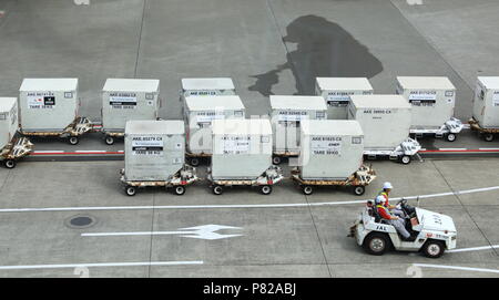 NARITA, JAPAN - MAY 2018 : Baggage Tug( baggage dolly transport ) in ground handling services at narita Airport, Japan. Stock Photo