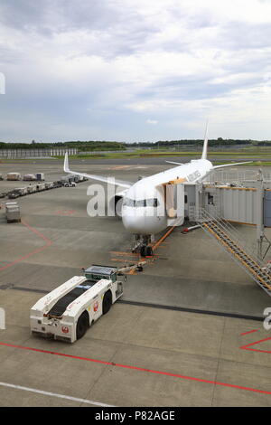 NARITA, JAPAN - MAY 2018 : Airplane Tugs, Machine for push back the aircraft to taxiway in ground handling services at narita Airport, Japan. Stock Photo