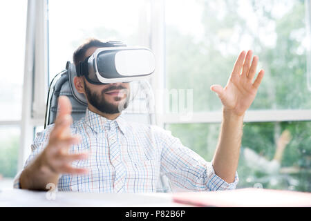 Handsome Bearded Man Using VR Stock Photo