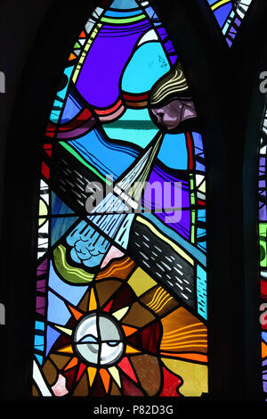 Stained glass by George Walsh in the refurbished windows at St Kentigerns Catholic Church in Eyeries Stock Photo