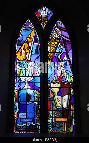 Stained glass by George Walsh in the refurbished windows at St Kentigerns Catholic Church in Eyeries Stock Photo