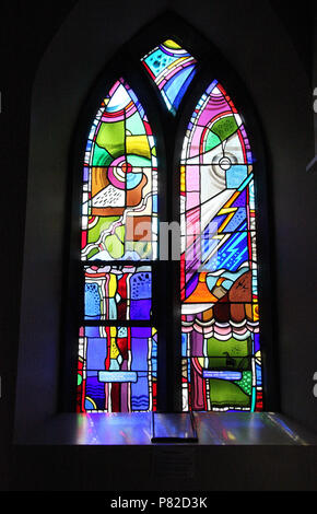 Stained glass by George Walsh in the refurbished windows at St Kentigerns Catholic Church in Eyeries Stock Photo