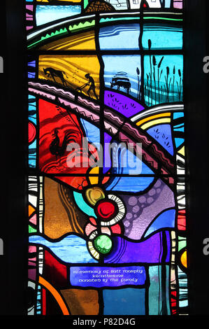 Stained glass by George Walsh in the refurbished windows at St Kentigerns Catholic Church in Eyeries Stock Photo