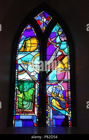 Stained glass by George Walsh in the refurbished windows at St Kentigerns Catholic Church in Eyeries Stock Photo