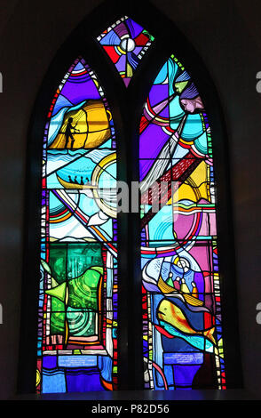 Stained glass by George Walsh in the refurbished windows at St Kentigerns Catholic Church in Eyeries Stock Photo