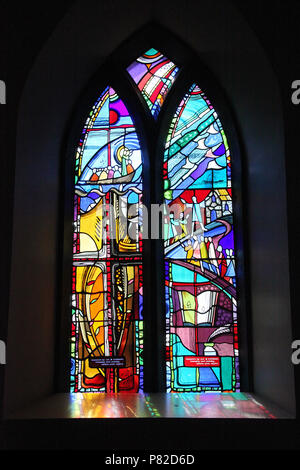 Stained glass by George Walsh in the refurbished windows at St Kentigerns Catholic Church in Eyeries Stock Photo