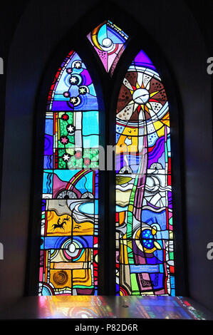 Stained glass by George Walsh in the refurbished windows at St Kentigerns Catholic Church in Eyeries Stock Photo