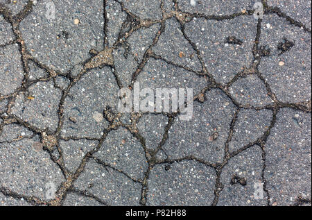 cracks on the asphalt pattern texture background Stock Photo