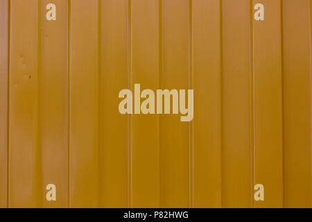 metallic yellow surface with vertical stripes pattern texture background Stock Photo