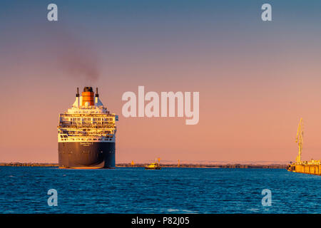 Adelaide, Australia - February 16, 2018: Cunard Line RMS Queen Mary 2 with people on board departing for a cruise from Outer Harbour, Port Adelaide Stock Photo