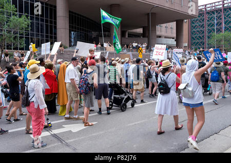 Minneapolis, MN/USA - June 30, 2018: Protesters march in the streets to support the national rally Families Belong Together in downtown Minneapolis. Stock Photo