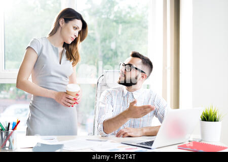 Two Business Managers Discussing Work Stock Photo