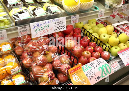 TOKYO, JAPAN - MAY 2018 : beauty and delicious japanese fruits show at shelf of local supermarket. Stock Photo