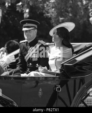 LONDON - JUN 09, 2018:  ( Image digitally altered to monochrome ) Prince Harry, Duke of Sussex and Meghan, Duchess of Sussex at the Trooping The Colour 2018 on the Mall Stock Photo