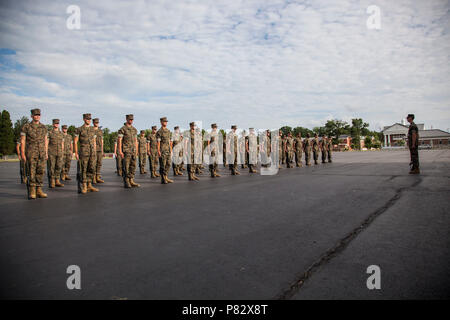 Candidates with India Company, Officer Candidate School (OCS), are evaluated in close order drill aboard Marine Corps Base Quantico, Va., August 4, 2016. The mission of OCS is to educate and train officer candidates in order to evaluate and screen individuals for qualities required for commissioning as a Marine Corps officer. Stock Photo