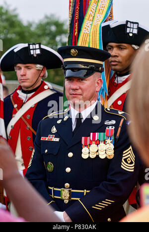 Fort Myer, Virginia - June 13, 2018: A First Sergeant of the Old Guard poses for photos in front of member of the U.S. Army Continental Color Guard. Stock Photo