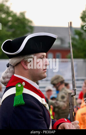 Fort Myer, Virginia, USA - June 13, 2018: A soldier of the U.S. Army's 'Old Guard' poses for tourist photos following a Twilight Tattoo performance. Stock Photo