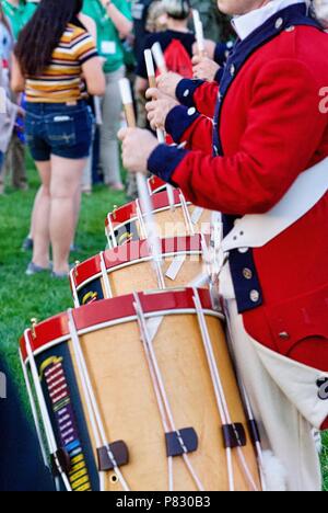 Fort Myer, Virginia, USA - June 13, 2018: Drummers of the U.S. Army Old Guard Fife and Drum Corps perform for visitors following a Twilight Tattoo. Stock Photo