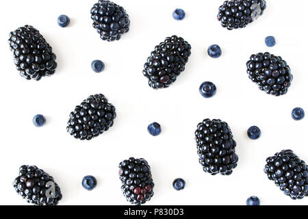 Styled stock photo. Summer healthy fruit composition with juicy blackberries and blueberries isolated on white table background. Food pattern. Empty s Stock Photo